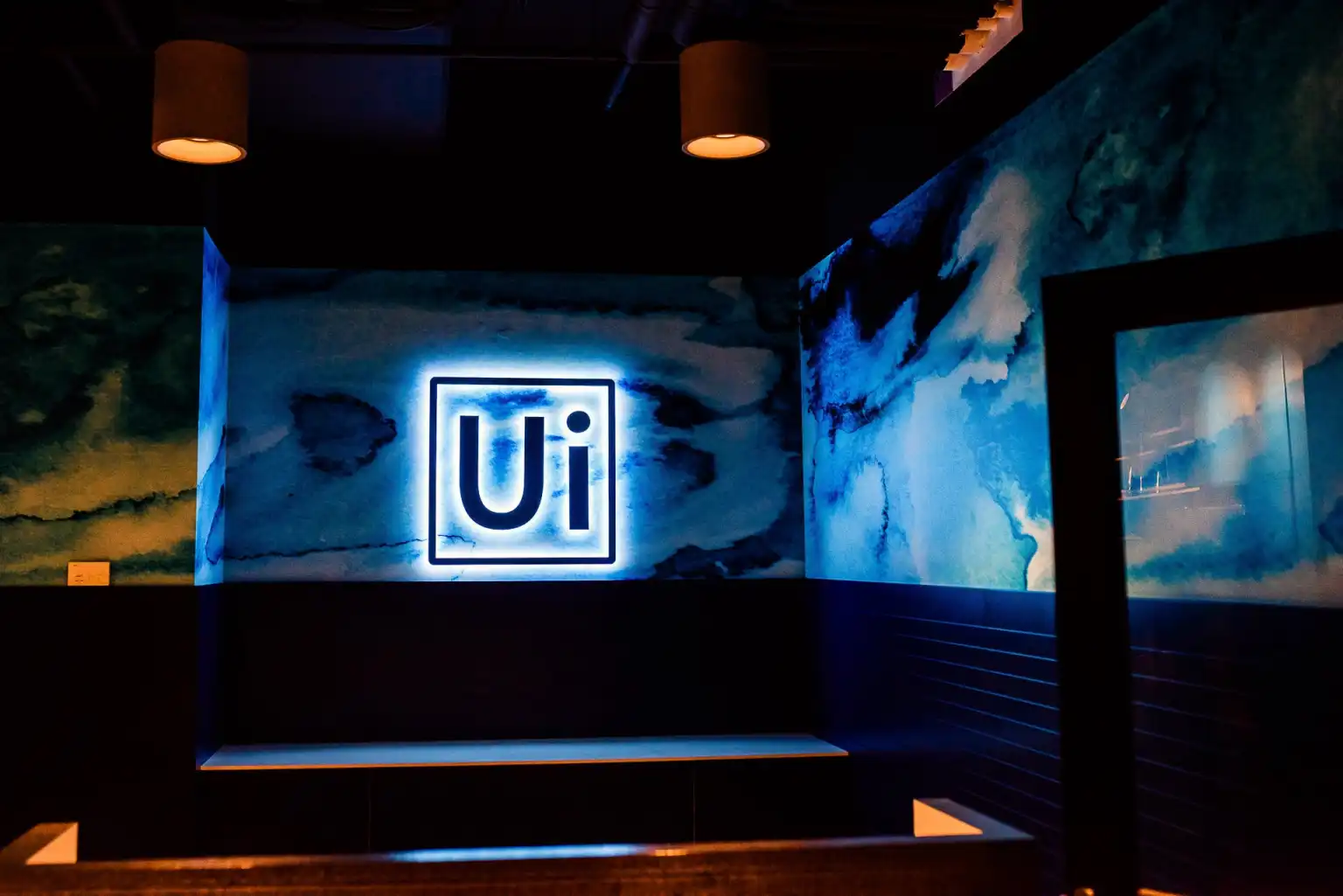 image of blue UiPath logo in UiPath office | UiPath and AI