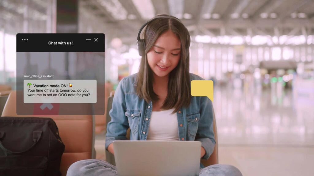 woman sitting at laptop using a chatbot to set an OOO | Yellow.ai SAP solution