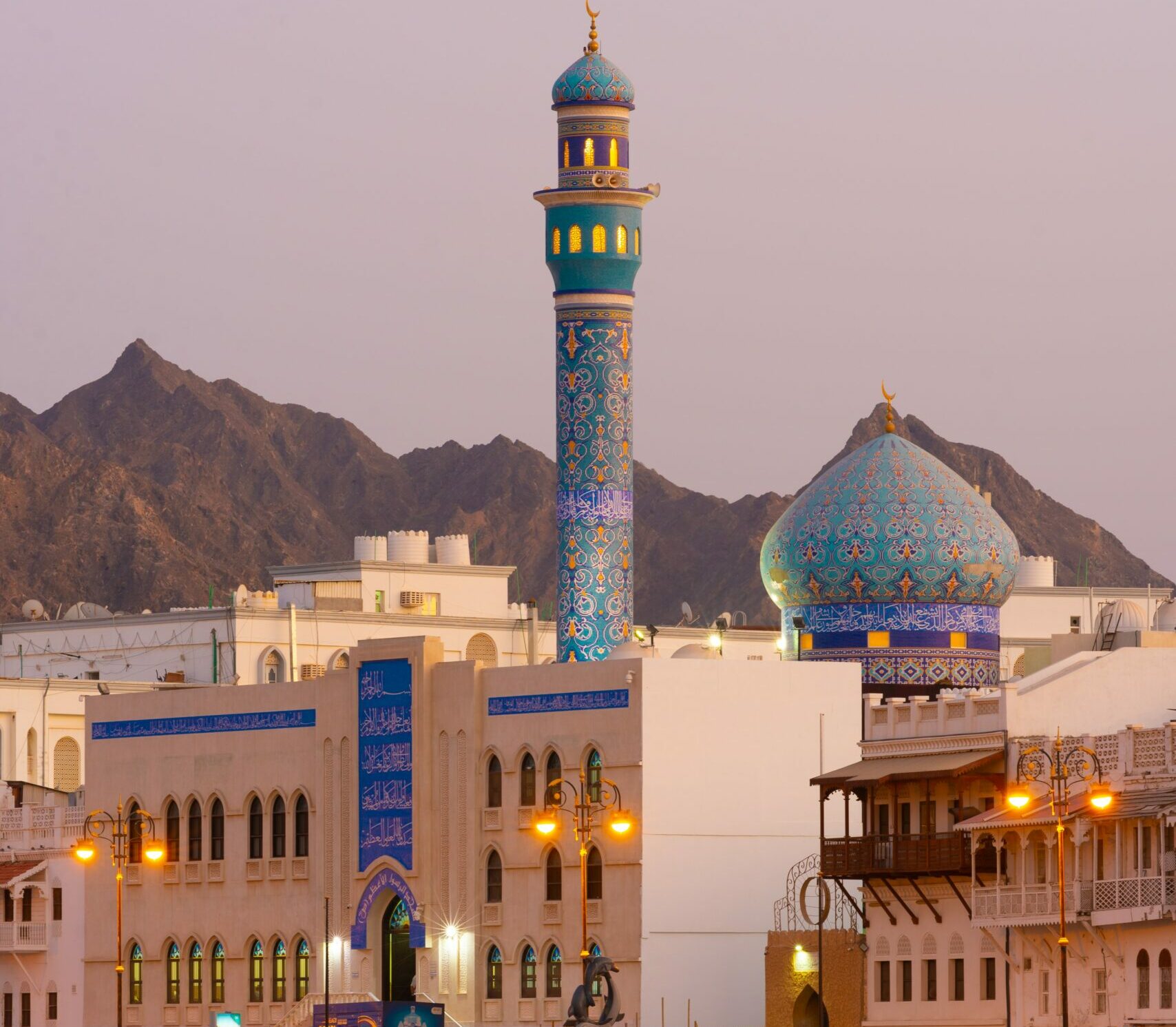 image of Oman, mountain scape background with beautiful buildings in the foreground | OQ SAP Oman Cloud Solutions