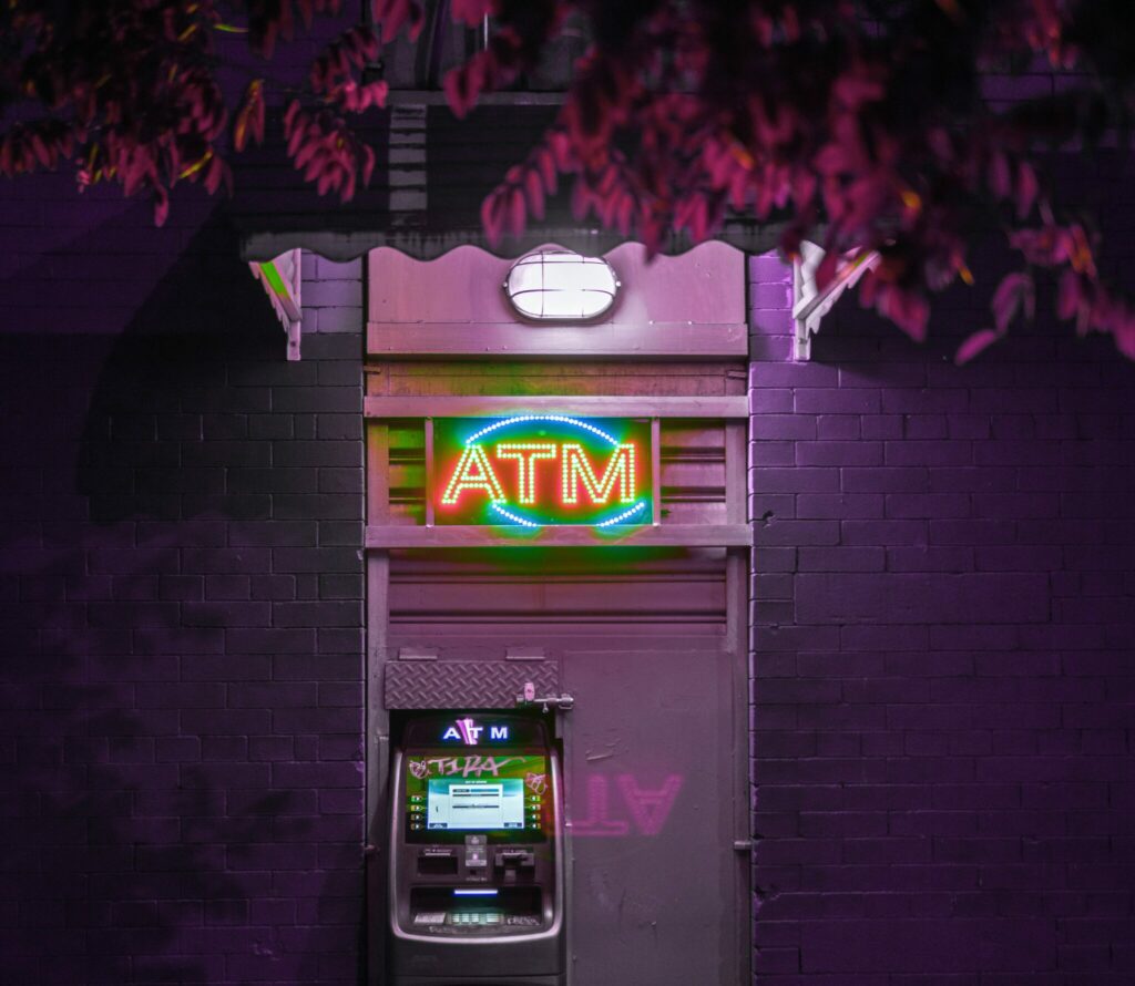 glowing ATM with neon lights | AI banking Google Cloud Macquarie AI online banking
