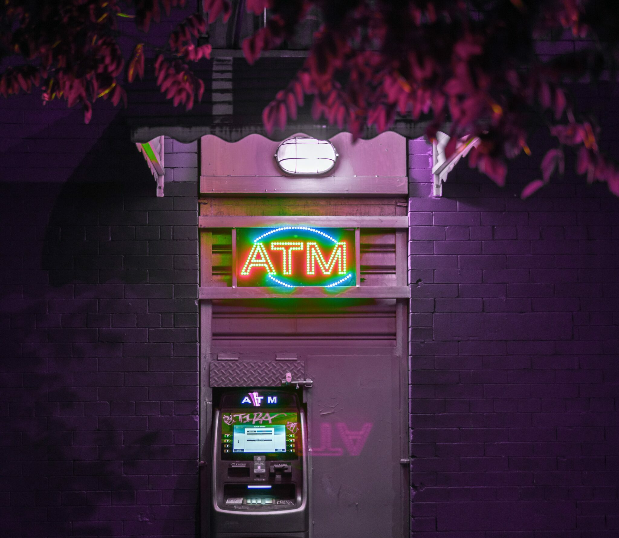 glowing ATM with neon lights | AI banking Google Cloud Macquarie AI online banking