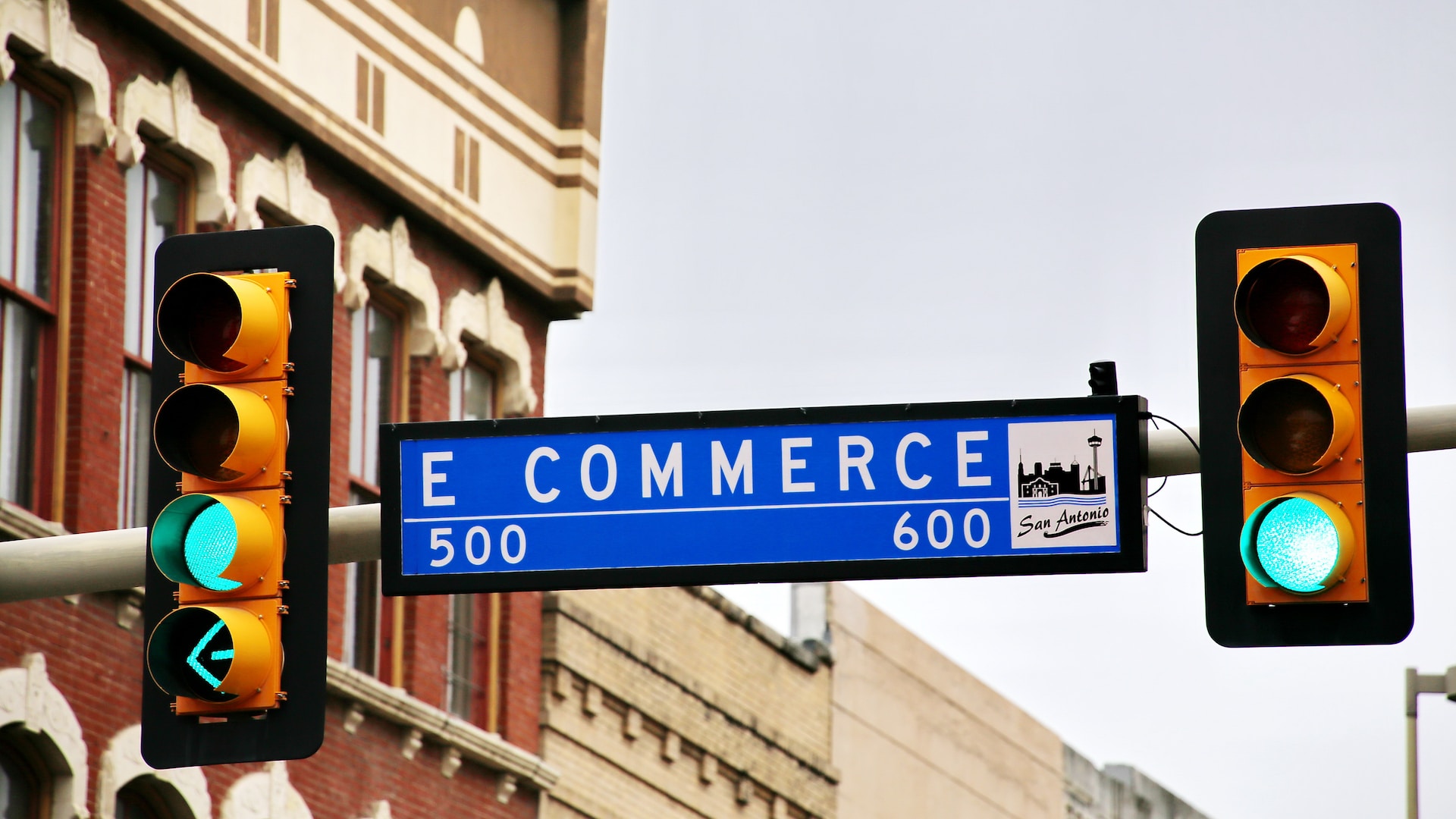 image of e-commerce sign in between two traffic lights showing green light | e-commerce