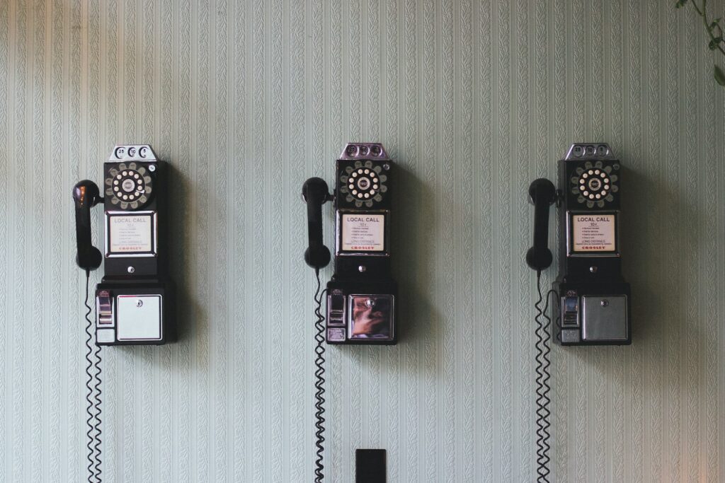 image of three old phones on a wall | HPE GreenLake