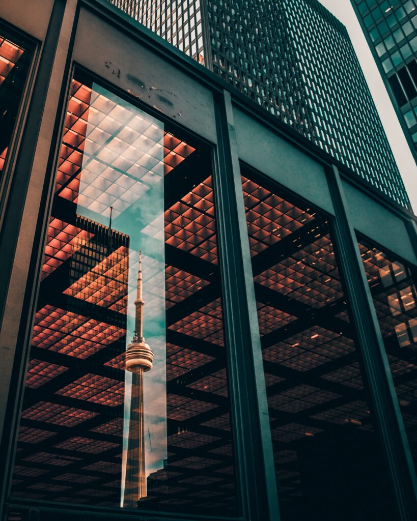 A building with the Toronto CN tower in the reflection. B2B Pivotree Touchette