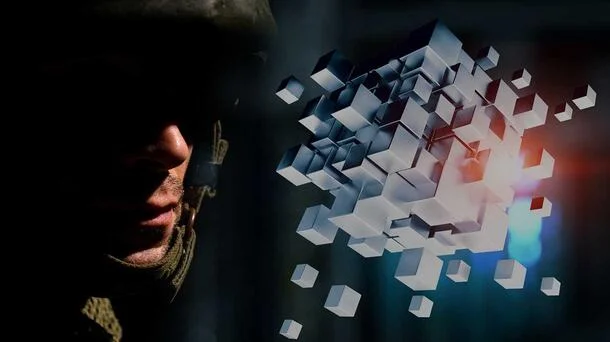 US soldier in front of some cubes : L2Harris