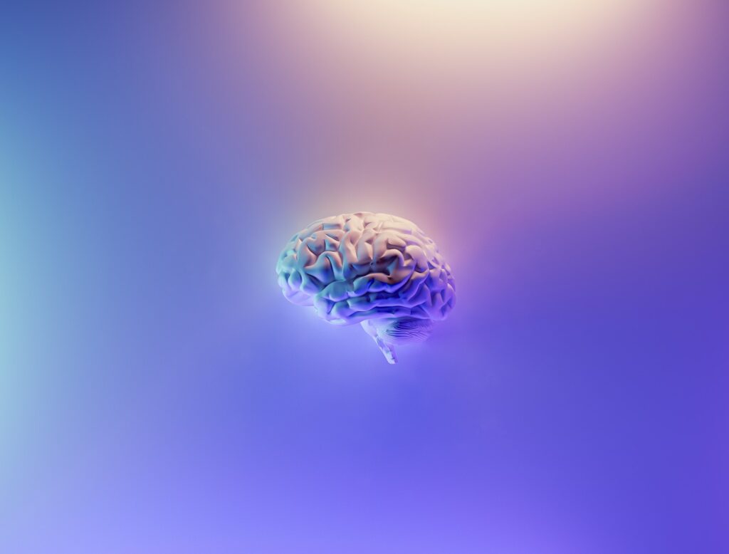 image of brain, AI on purple, blue and yellow pastel background | CX Foundry