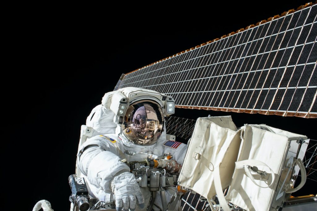 Astronaut in space fixing a satellite | Accenture and Open Cosmos
