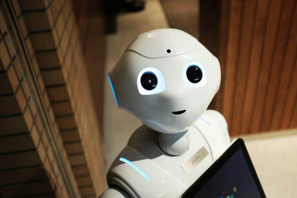 An inquisitive, child-like robot looking up at the camera, with no soul behind the eyes | MyWave.AI
