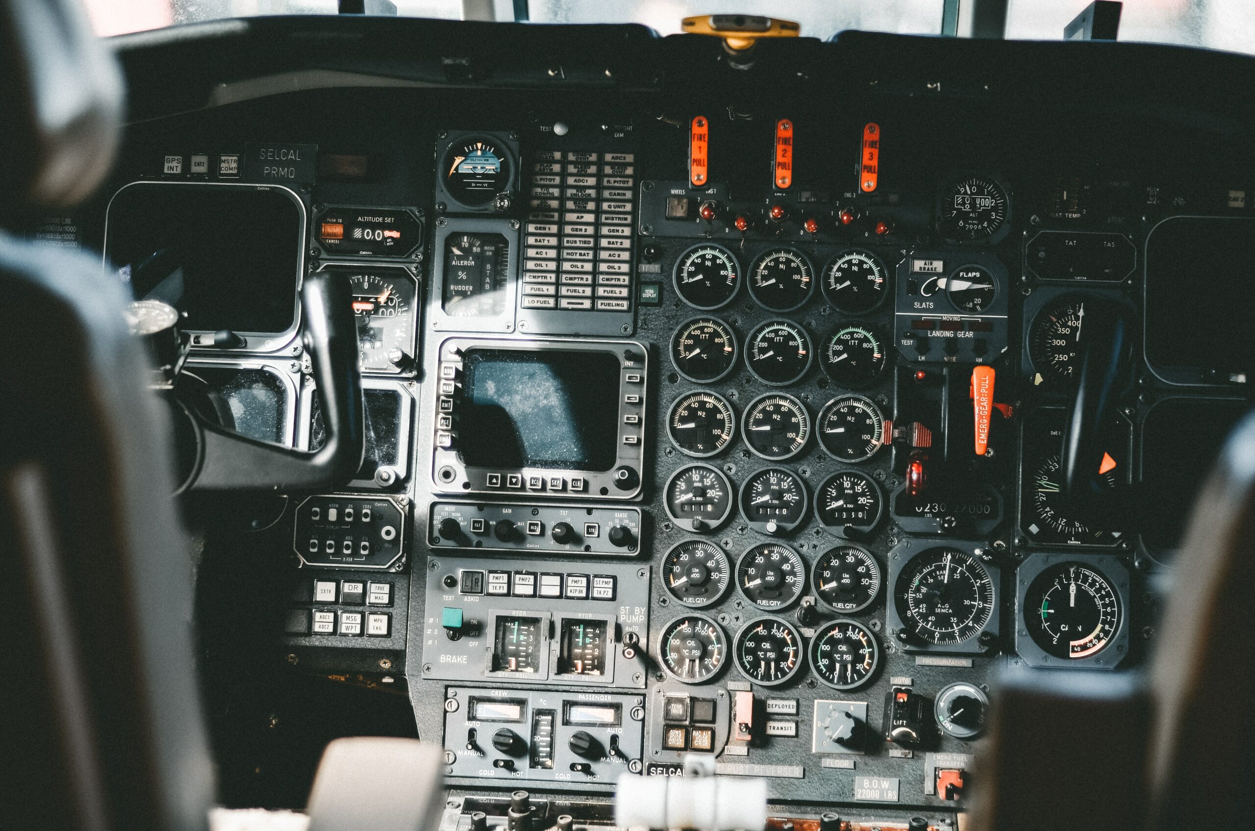Close-up of a pilot's cockpit and complex controls, with several dials and meters | Original Software test automation