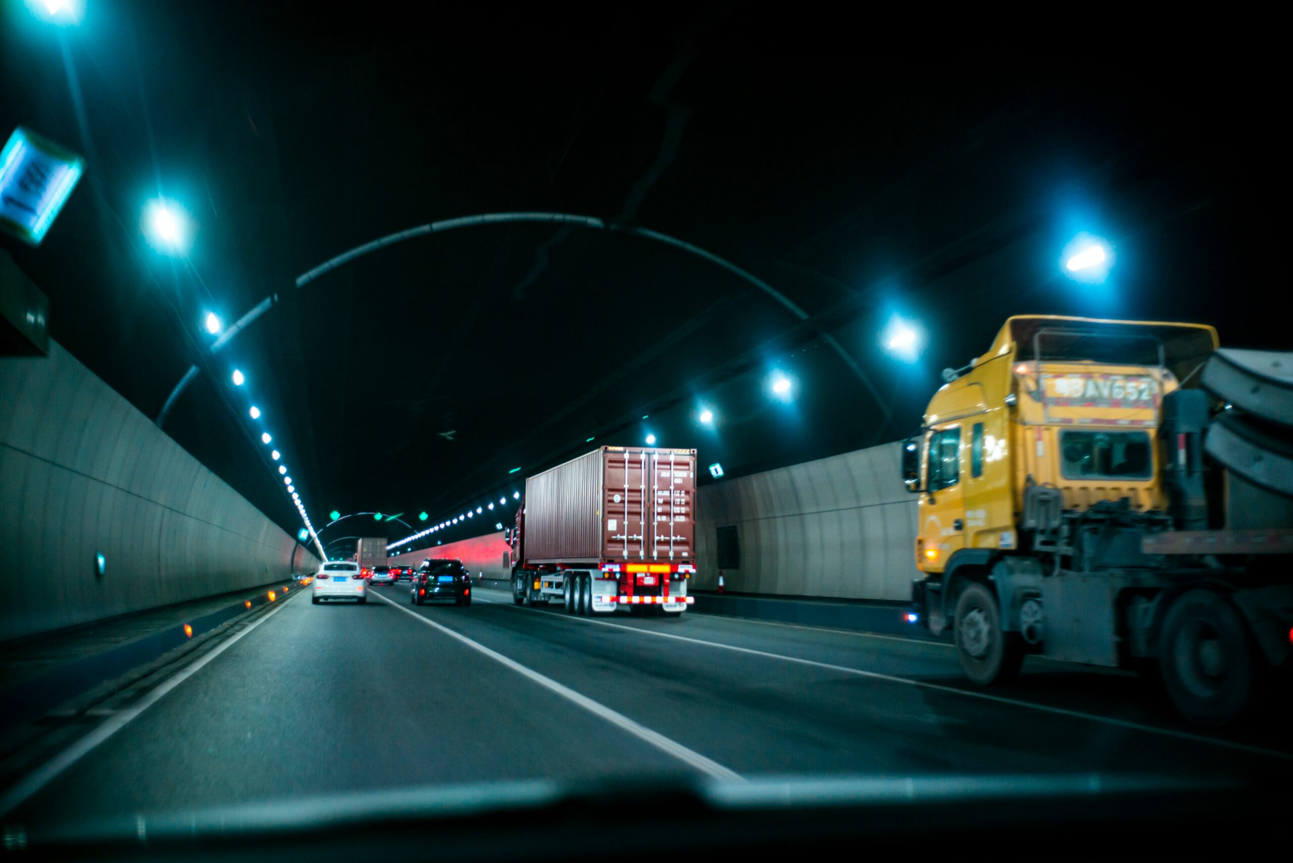Dark tunnel half full with trucks and lorries | Connected Operations Cloud Samsara