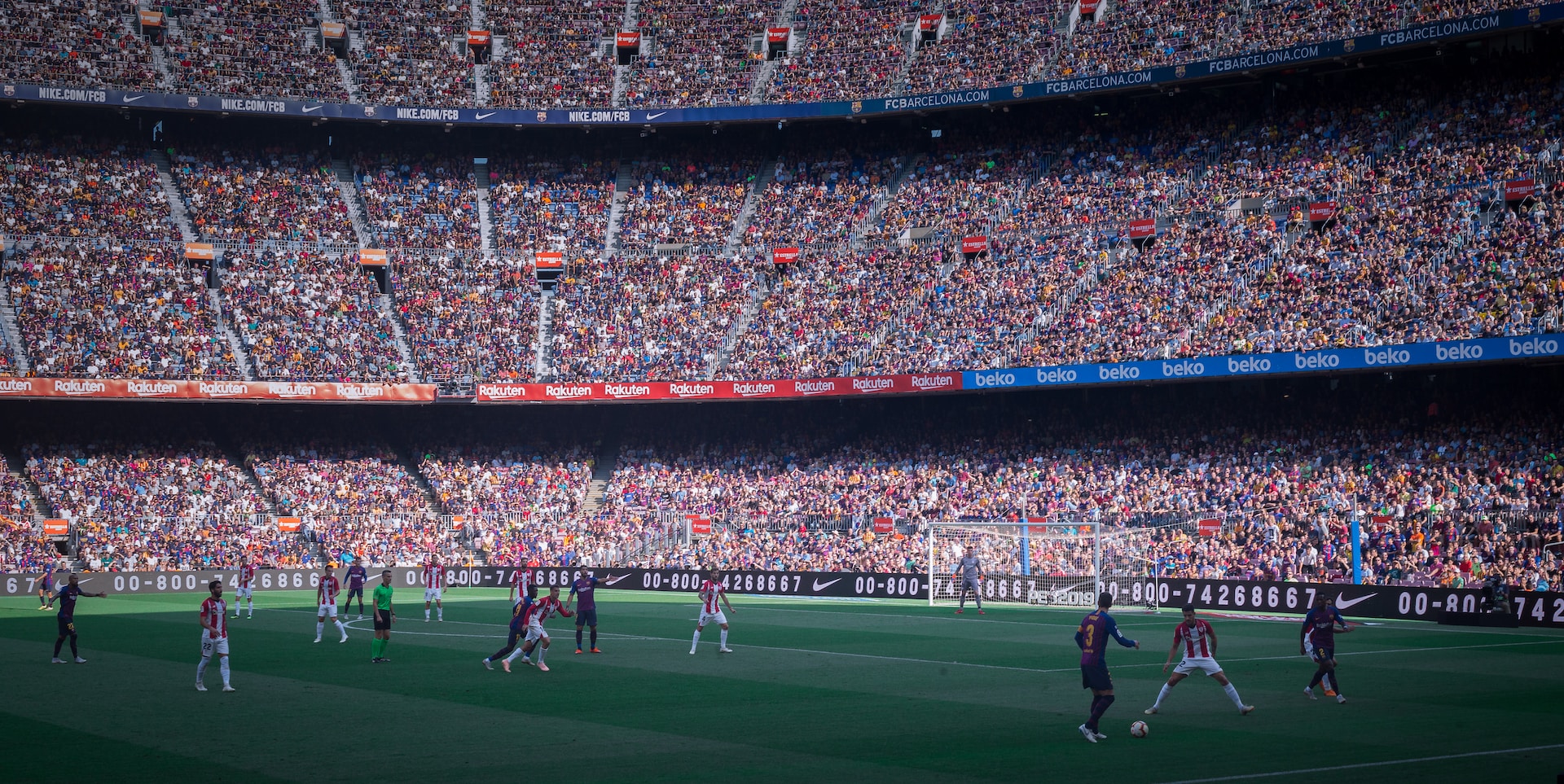 image of football stadium in Barcelona, Spain with two football teams. | Atos and UEFA