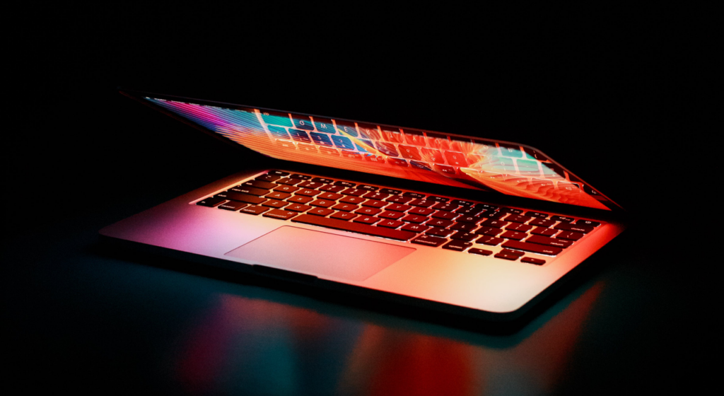 colorful laptop in a dark background
