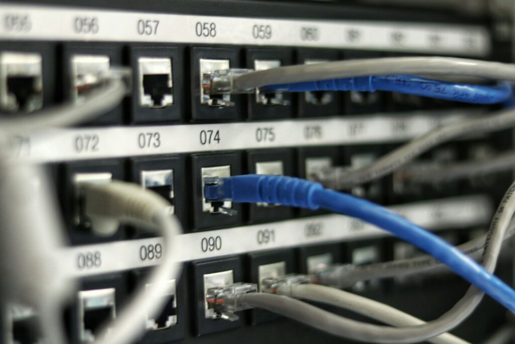 A series of cables plugged into a connection board | Global Shop Solutions on-premise ERP