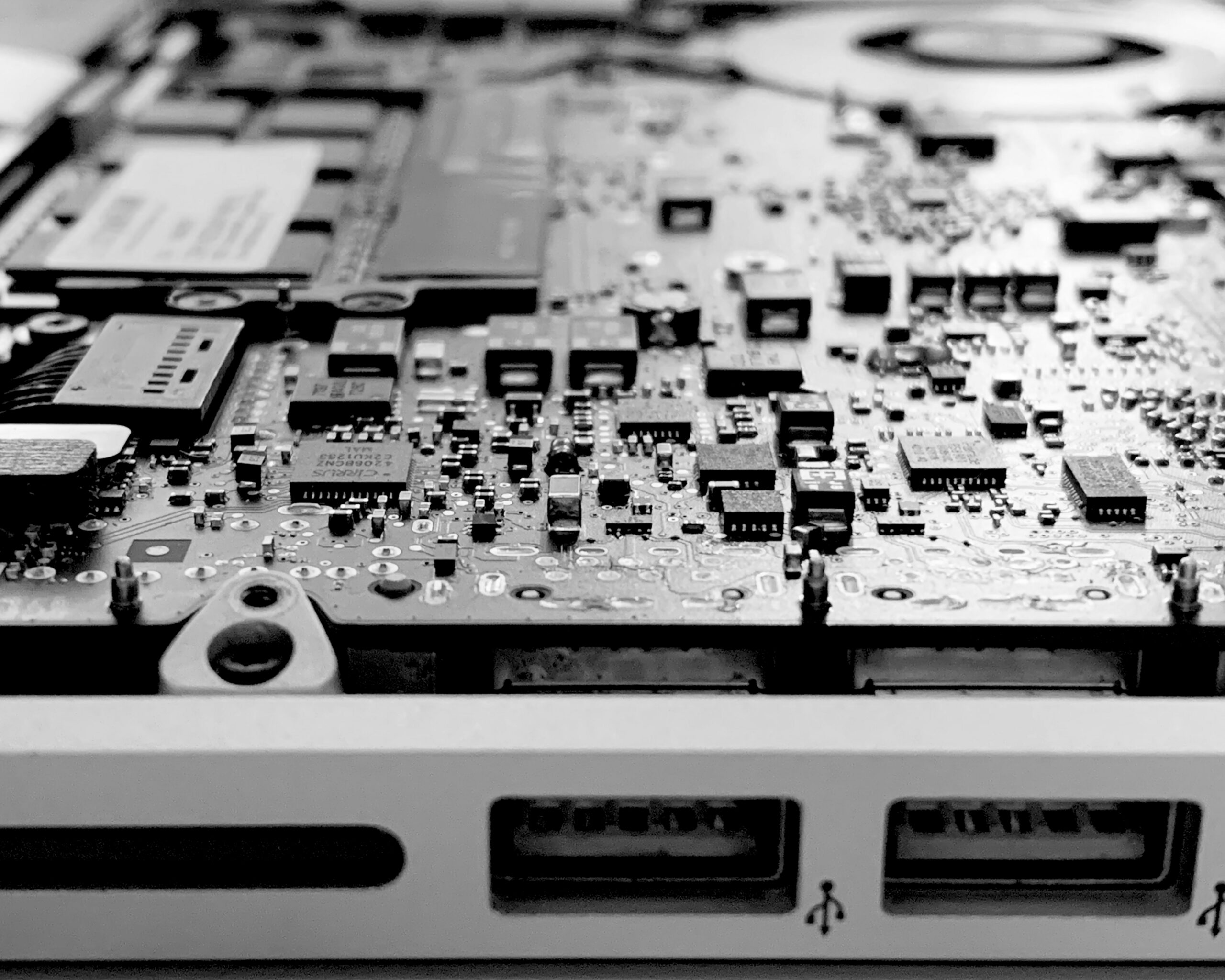 A black and white image of a laptop circuitboard |