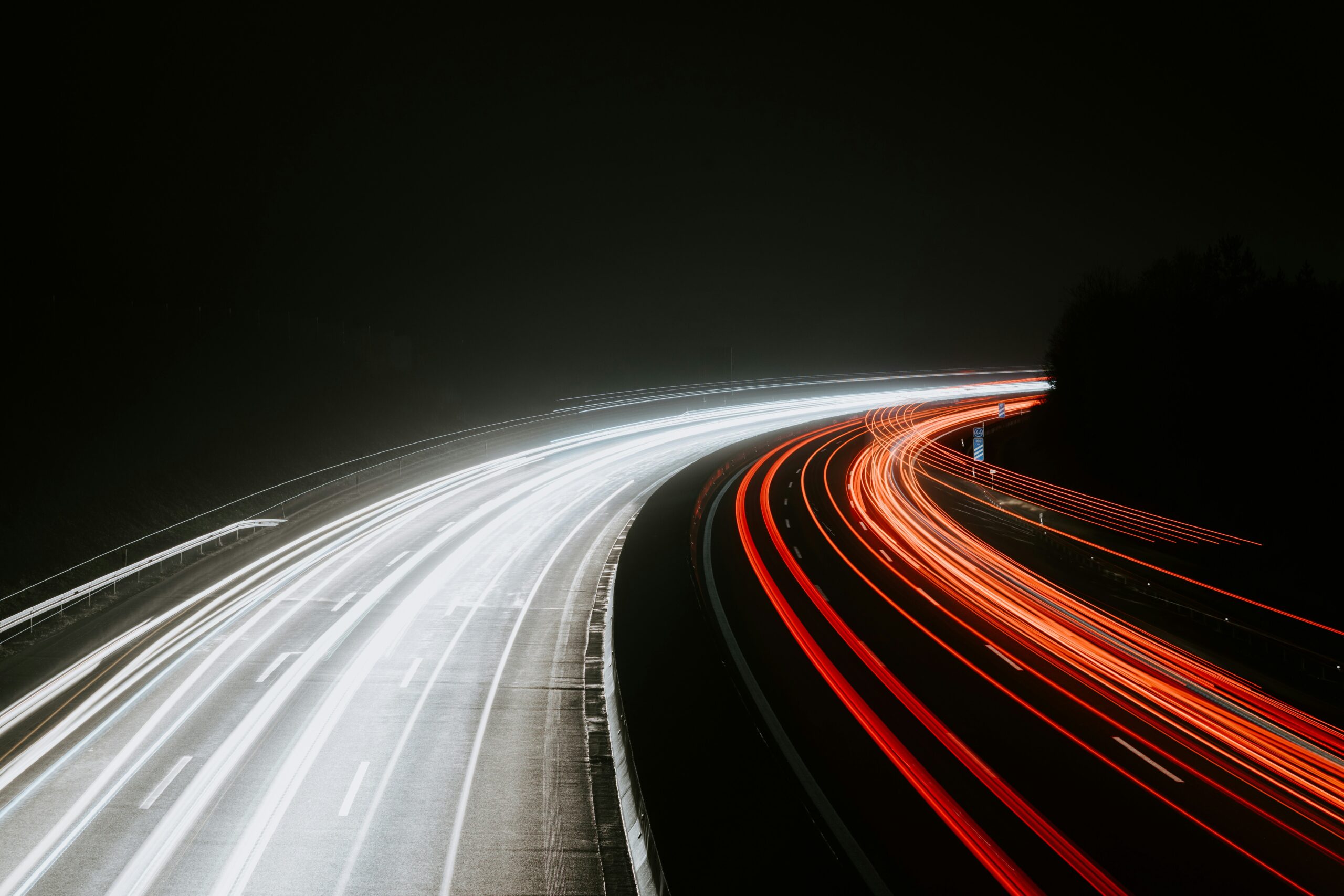 long exposure photograph of a highway, lightspeed effect; innovation and AI concept