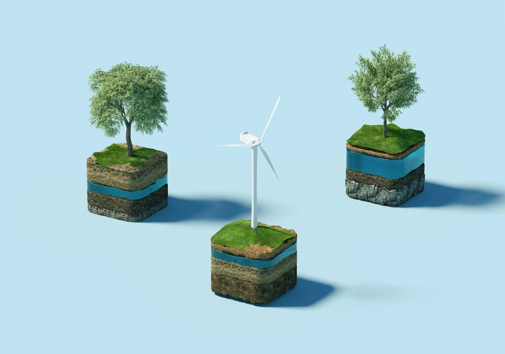 trees planed in soil next to a wind turbine | Salesforce Catalyst Fund expands climate efforts and access to education