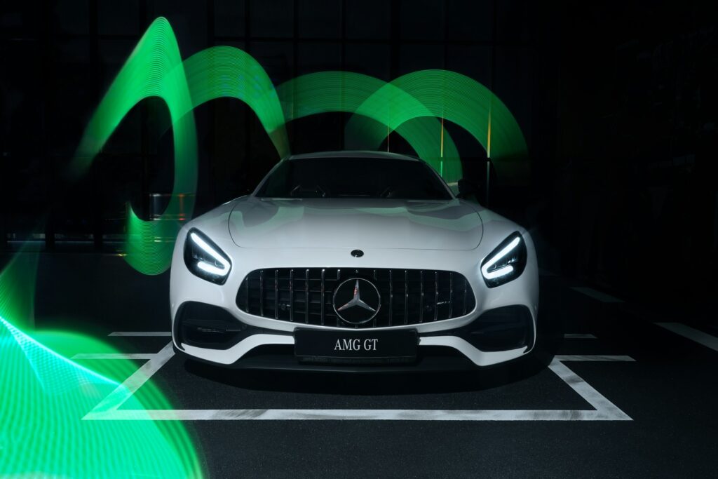 image of a white Mercedes-AMG GT S with green lights in the background | Mercedes-Benz and Google Cloud