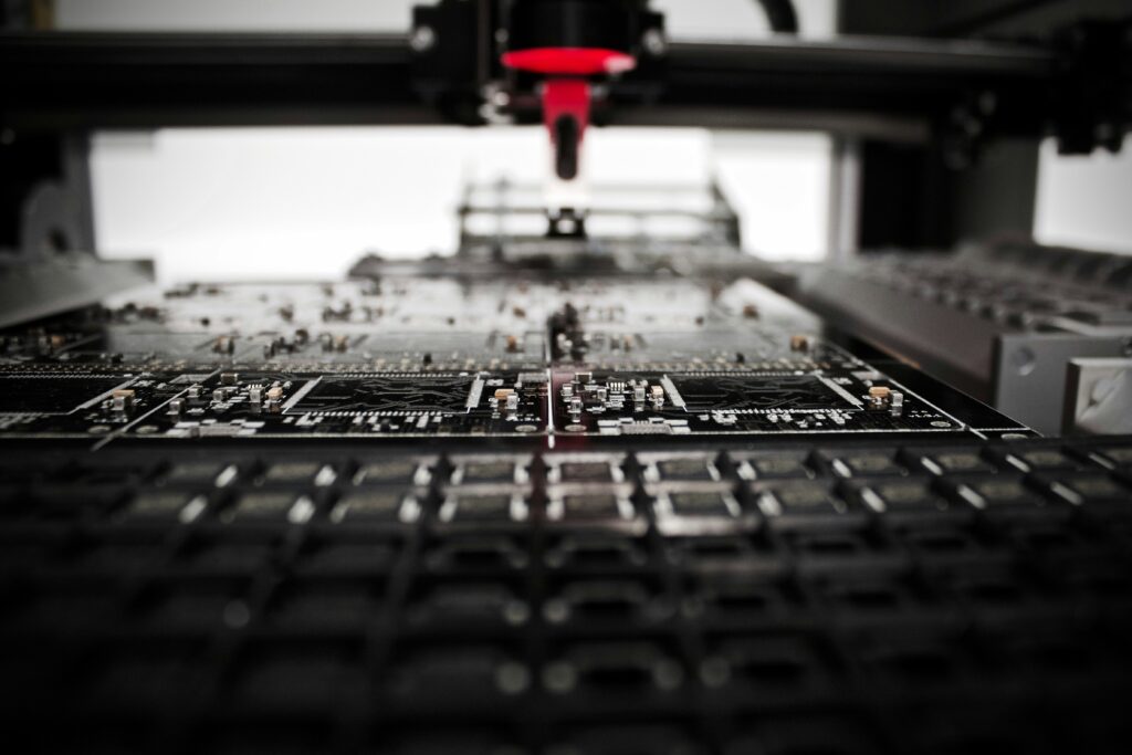 Closeup of a computer board being constructed | EventSense Rossera