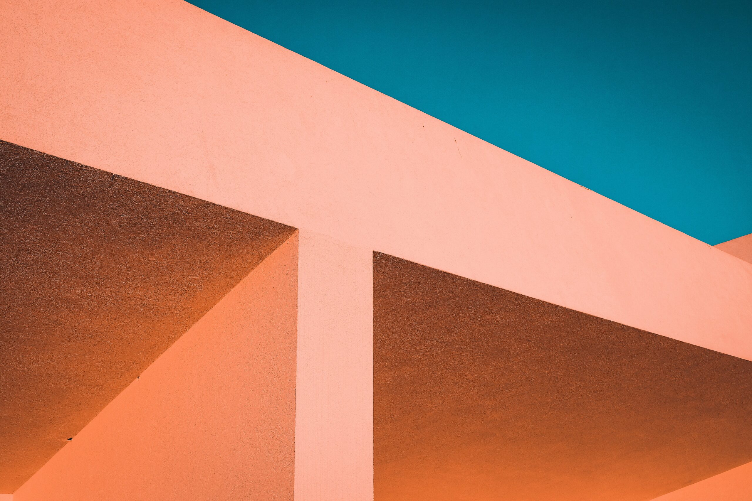 orange and white concrete building under blue sky during day time; cloud integration concept