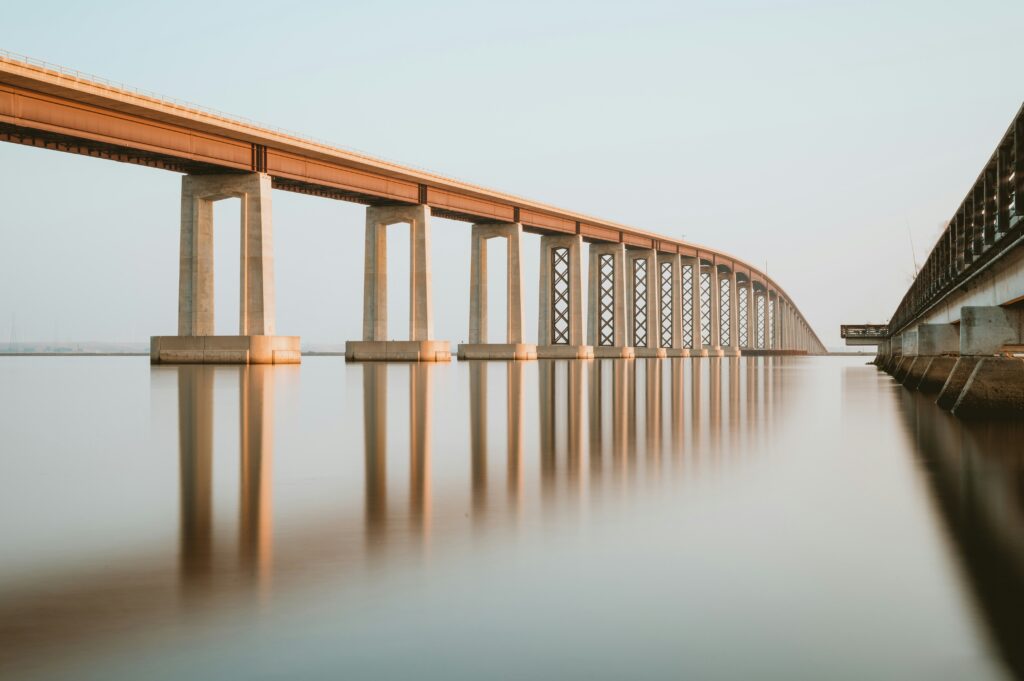 brown bridge over a body of water | Oracle OCI cloud