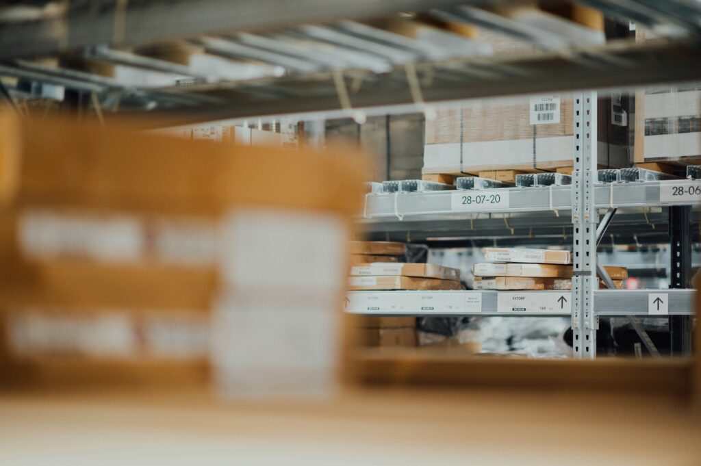 shallow focus photo of grey steel muscle rack in a warehouse | Accelalpha case study for its financial account reconciliation assistance services