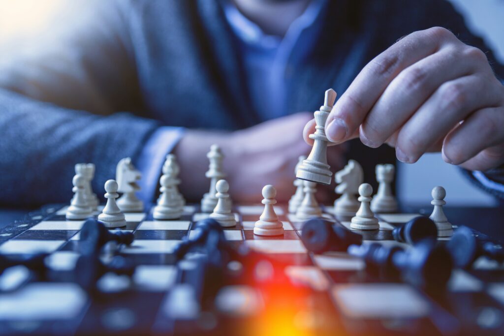 photo of a man playing chess | guide on third-party support for CFO leaders