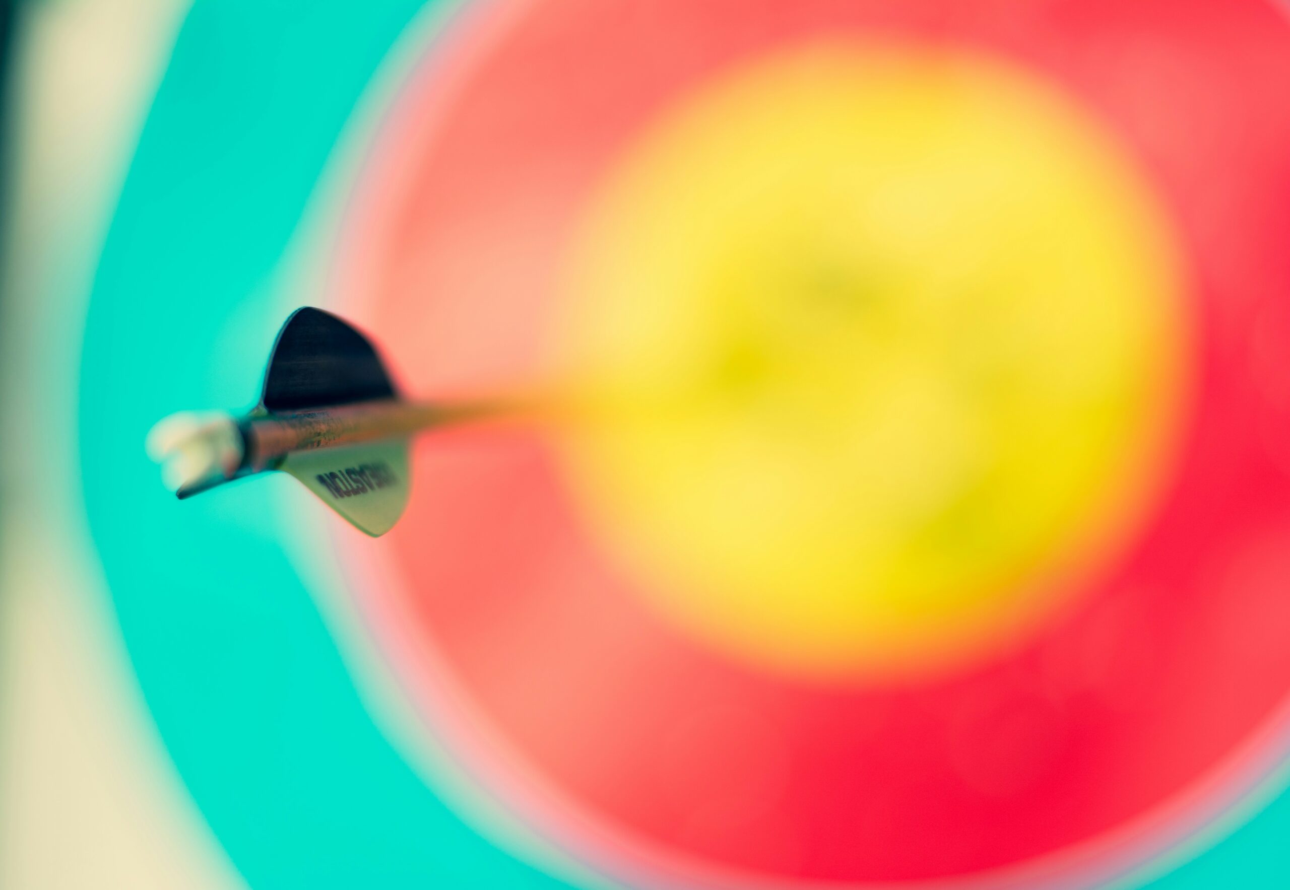 a blurred image of a target with a darts sticking out in the middle | Shaping customer trust through the powerful pairing of inventory control