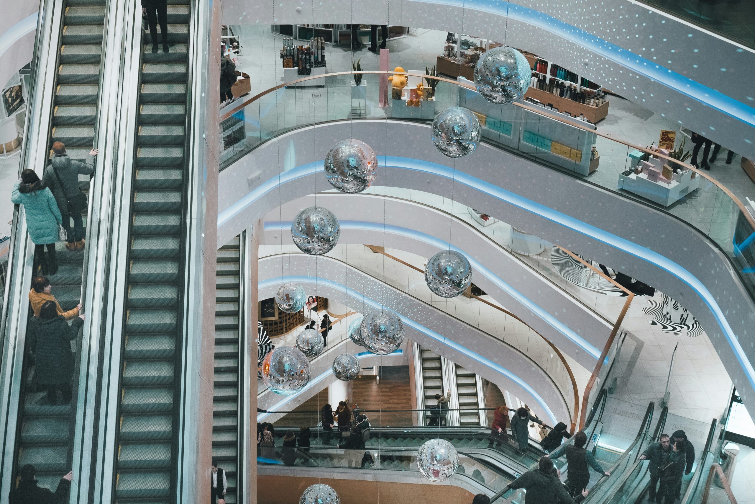 aerial photograph of a shopping mall with escalators and multiple floors | Salesforce solutions for customer experience