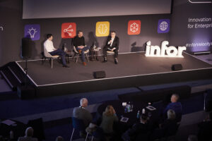 photo of three men on stage at Infor Velocity Tour