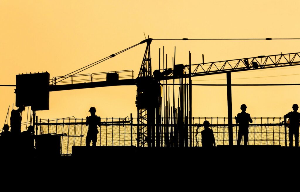 image of construction workers silhouettes | In4Suite ERP