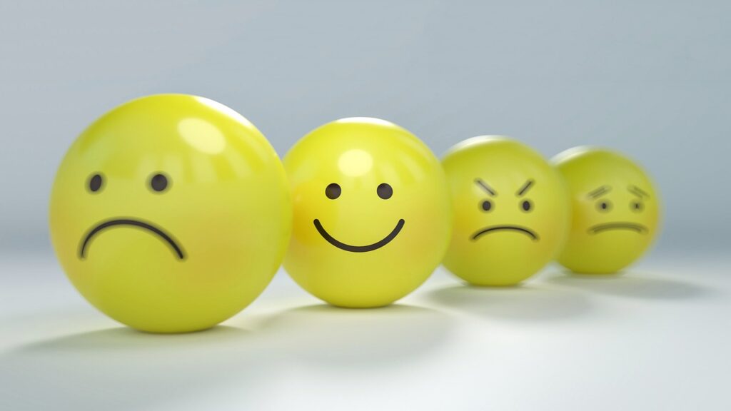 yellow smiley and frowning faces | Applying user psychology for successful change management and ERP implementation