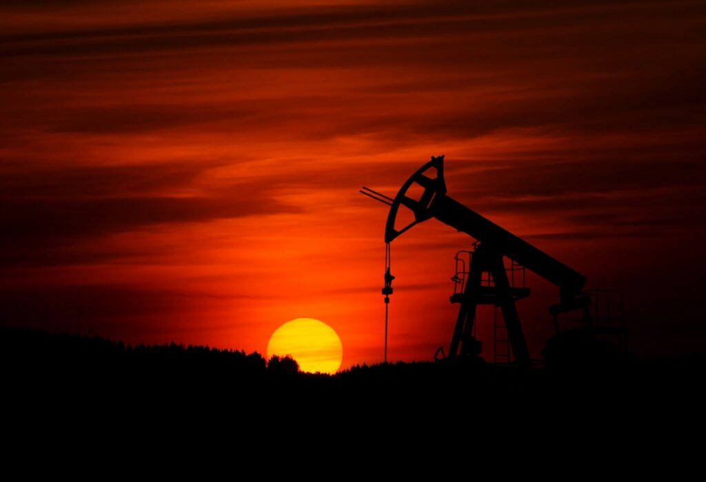 Pump-jack mining crude oil with the sunset | ESG compliance solutions IFS