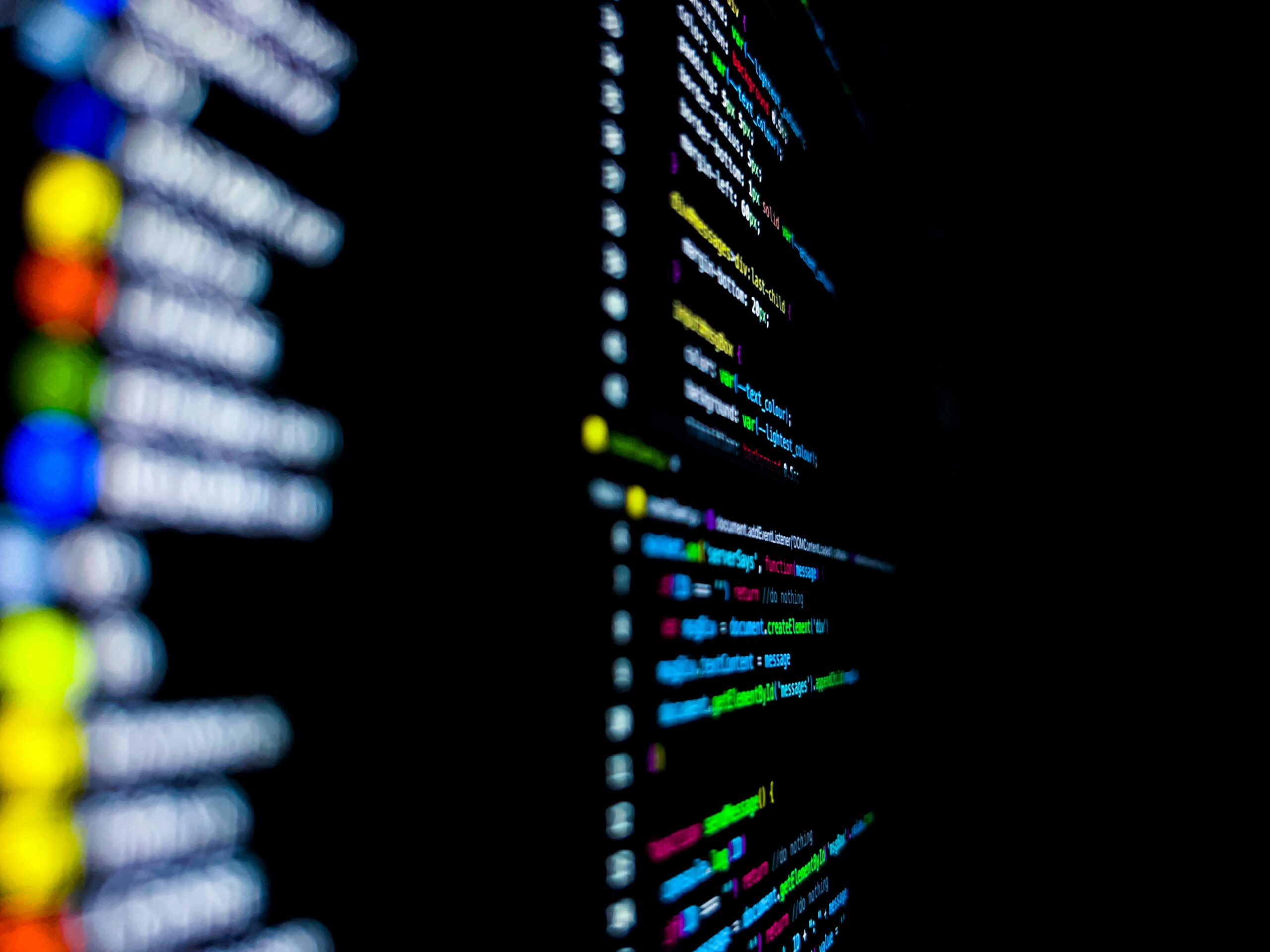 A blurry close up of a black screen showing snippets of code | Spinnaker composable