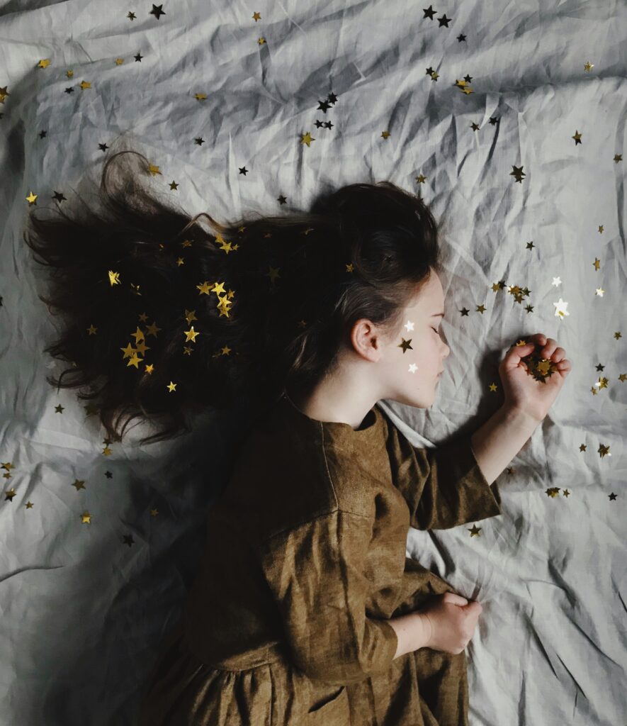 Image of a child dreaming covered in golden stars | Make-a-Wish, Microsoft Nerdio