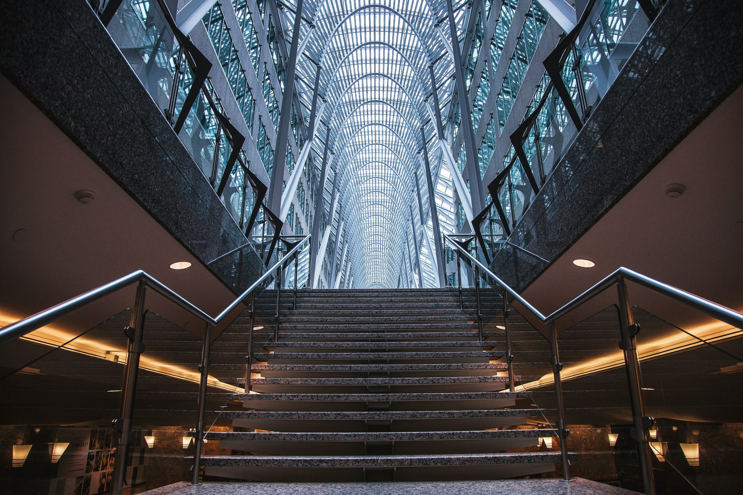 grey concrete stairs inside a building | Oracle Ascend 2024 conference