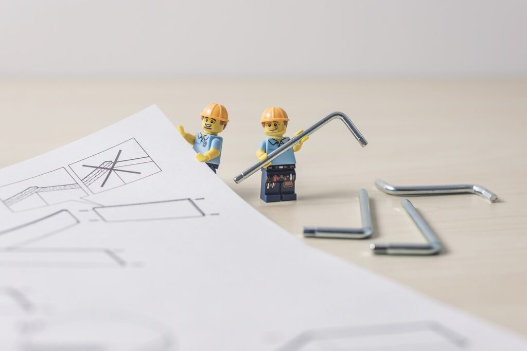 lego repairmen holding metal tools and looking at an assembling manual | Optimizing Oracle toolboxes with extended functionality