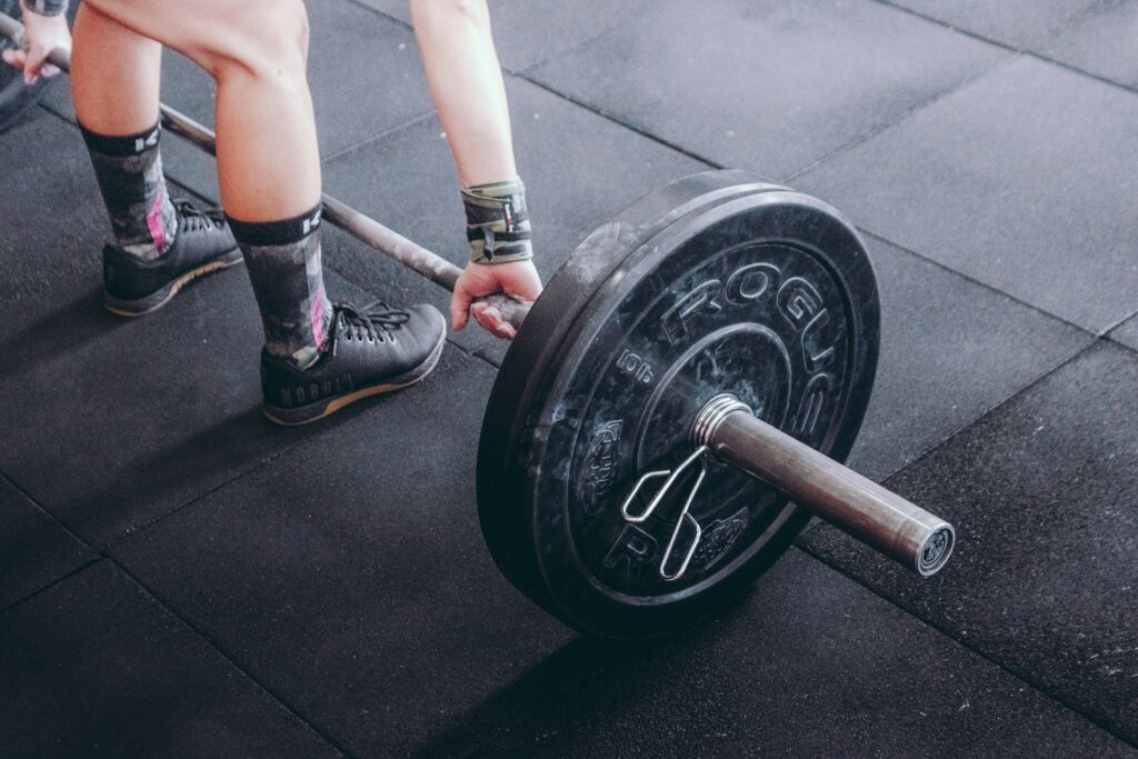 a person lifting weights in the gym | Getting software and infrastructure do the heavy lifting amid tough market conditions