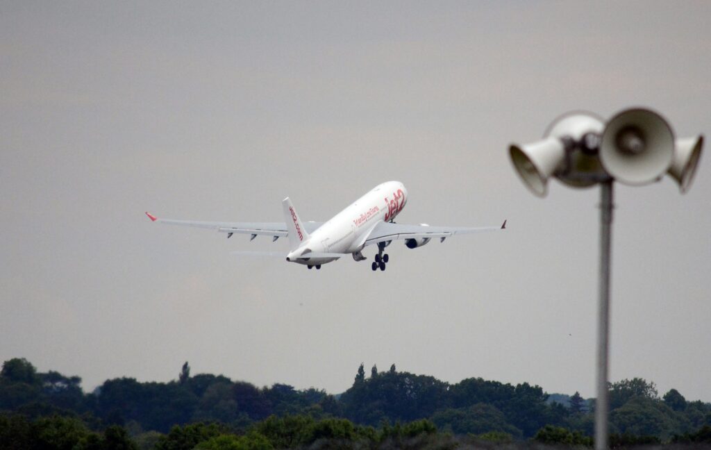 a photo of a plane taking off from Manchester airport | MAG collaboration with Inetum