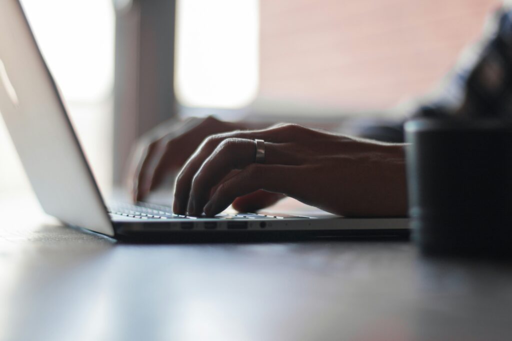 close up of someone's hands typing at a laptop | S/4HANA