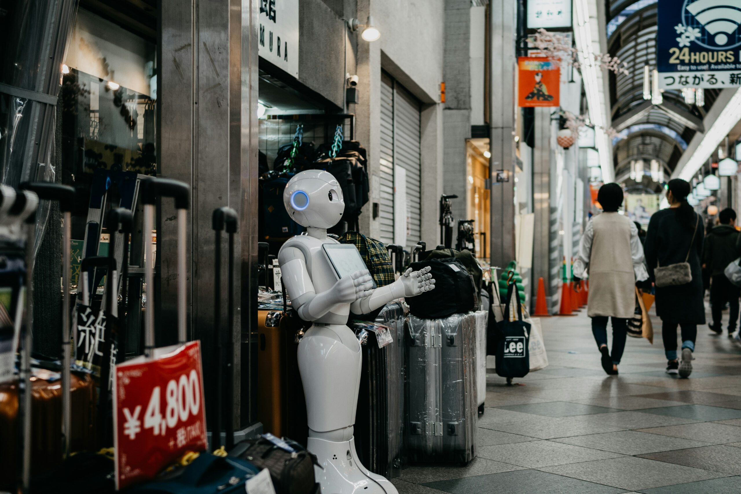 a robot standing outside a shop | How AI can drive more economic growth than lower taxes or less regulation, UK businesses weigh in