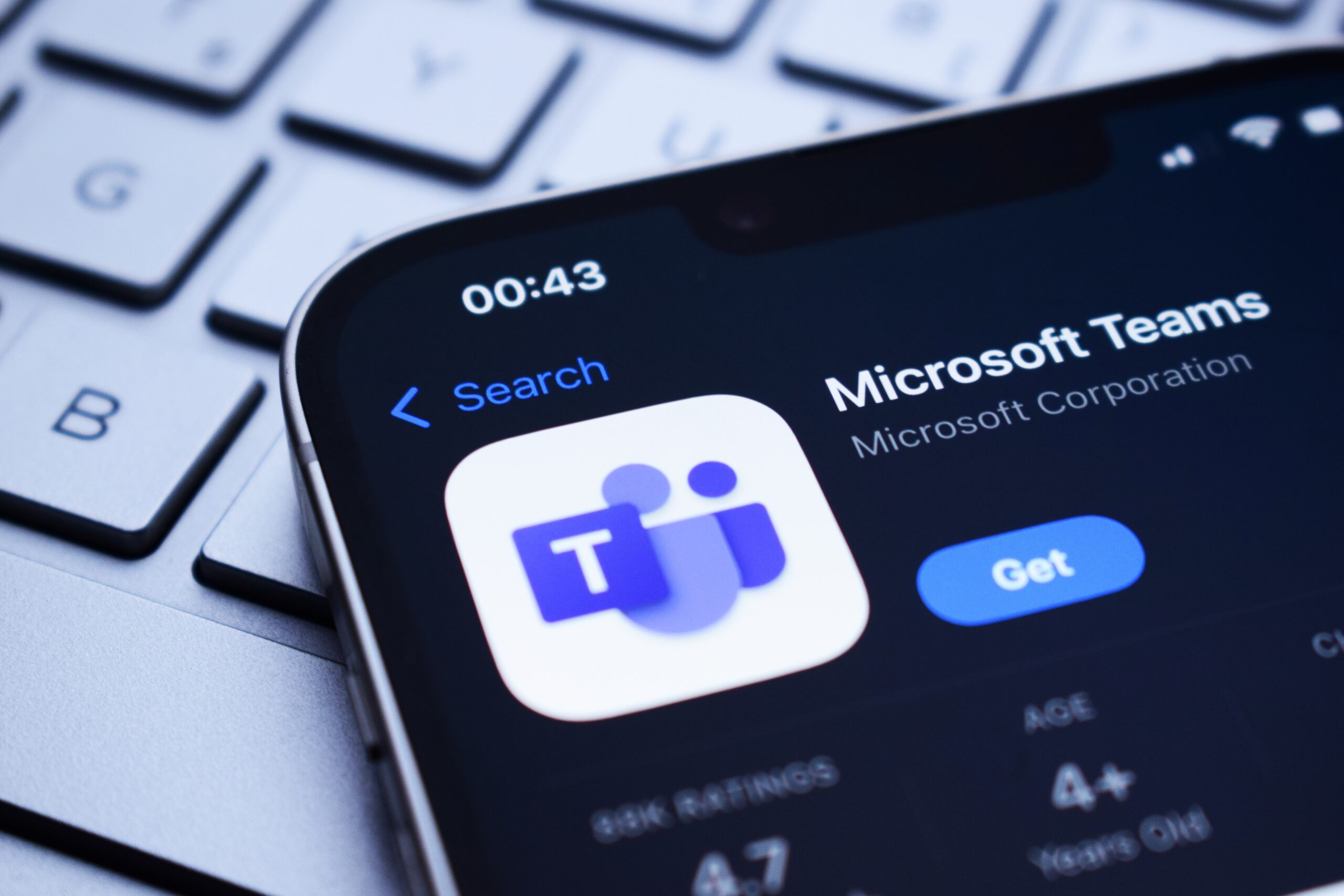 Microsoft Teams App opened on a phone that is sitting on a keyboard