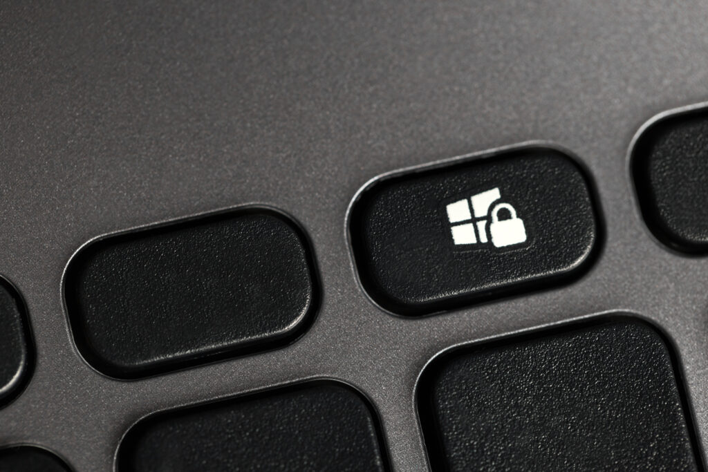 Keyboard with a key that shows a Microsoft logo with a lock over it