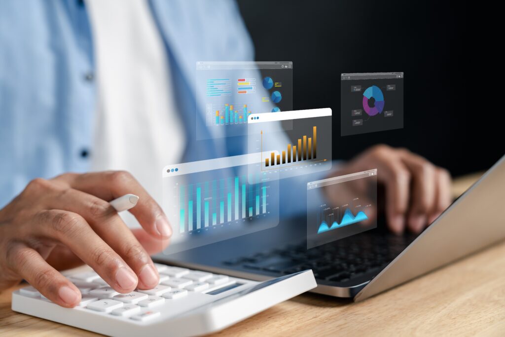 Accounting professional using ERP dashboards and real-time financial analytics on a laptop.