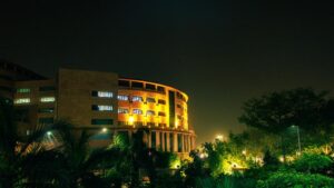 Bharat Mandapam in New Delhi illuminated at night during the India AI Impact Summit 2026.