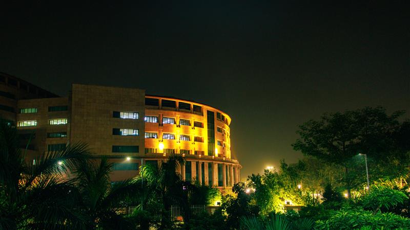 Bharat Mandapam in New Delhi illuminated at night during the India AI Impact Summit 2026.