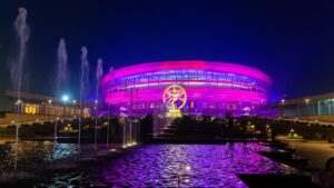 Bharat Mandapam New Delhi lit at night during India AI Impact Summit highlighting AI infrastructure and enterprise platform strategy discussions.