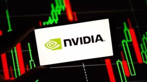 Nvidia logo displayed against stock market chart background symbolizing AI infrastructure growth and earnings performance.