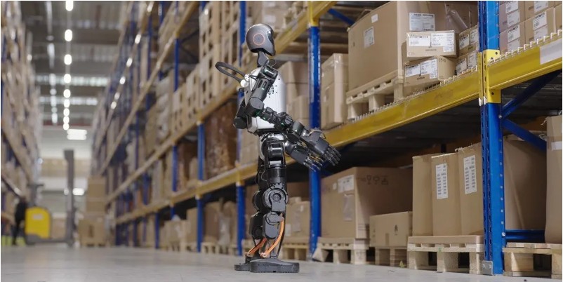 A humanoid robot checking for misplaced or improperly stacked items_SAP EWM humanoid robotics