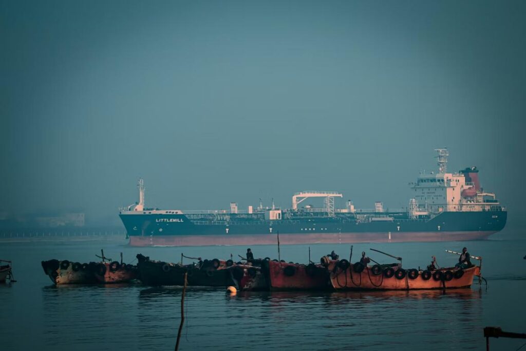 Cargo ship at port in Chattogram, Bangladesh representing global apparel exports and supply chain logistics.