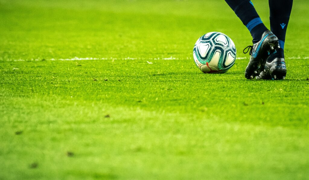 man-playing-soccer-game-on-field-_ SAP embedded AI workflows TSG Hoffenheim